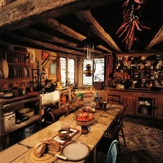 Image from cineplex.com. Notice Molly Weasley's more rustic and cluttered style in her home. No tablecloth or place mats, on a natural wood table.