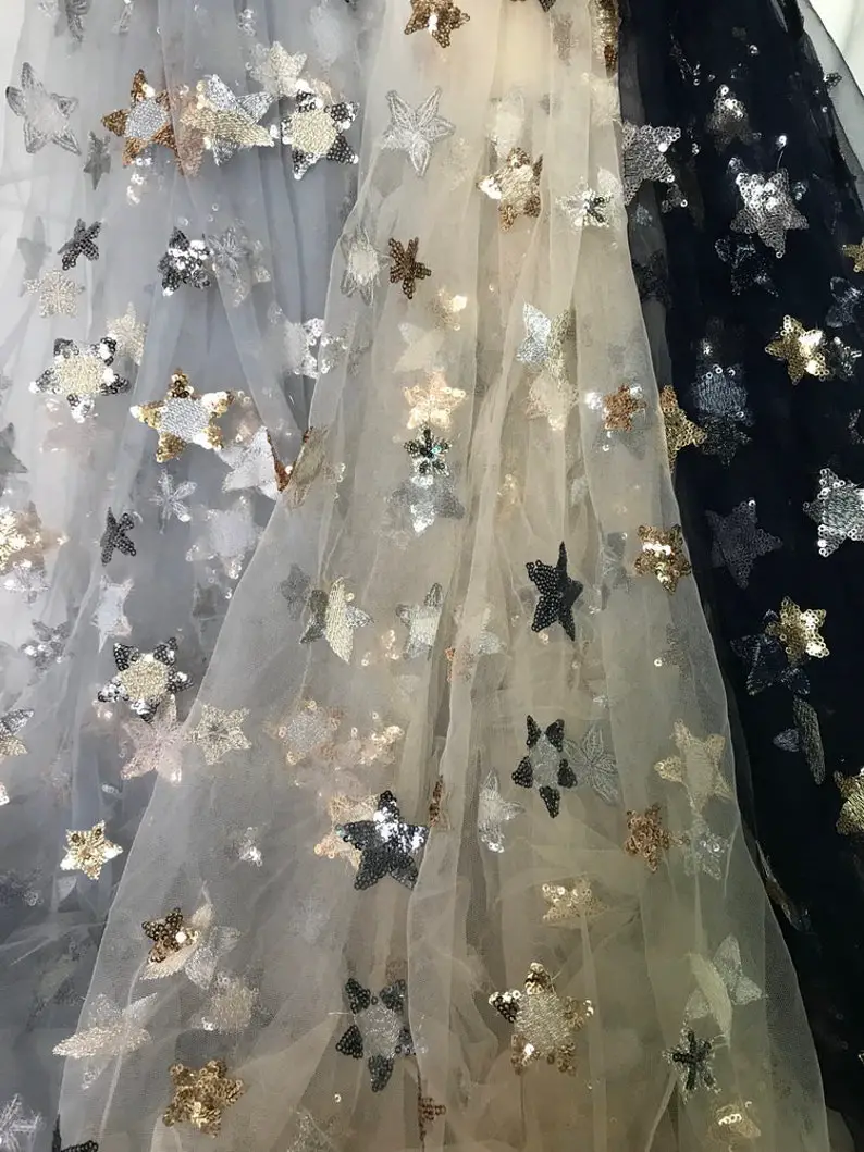 Beautiful stars lace fabric by lacelindsay on Etsy - Sparkly celestial wedding theme ideas - The Wedding Club