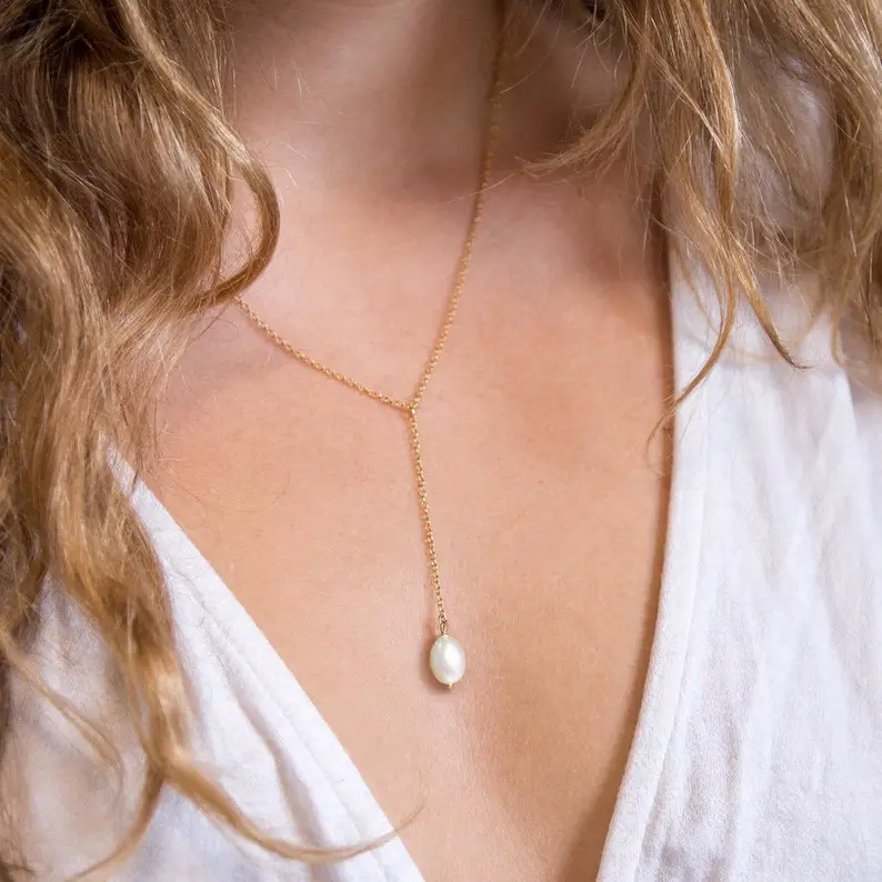Dainty Pearl Drop Necklace by delezhen on Etsy - 7 Tips for accessorizing with pearls on your wedding day - The Wedding Club