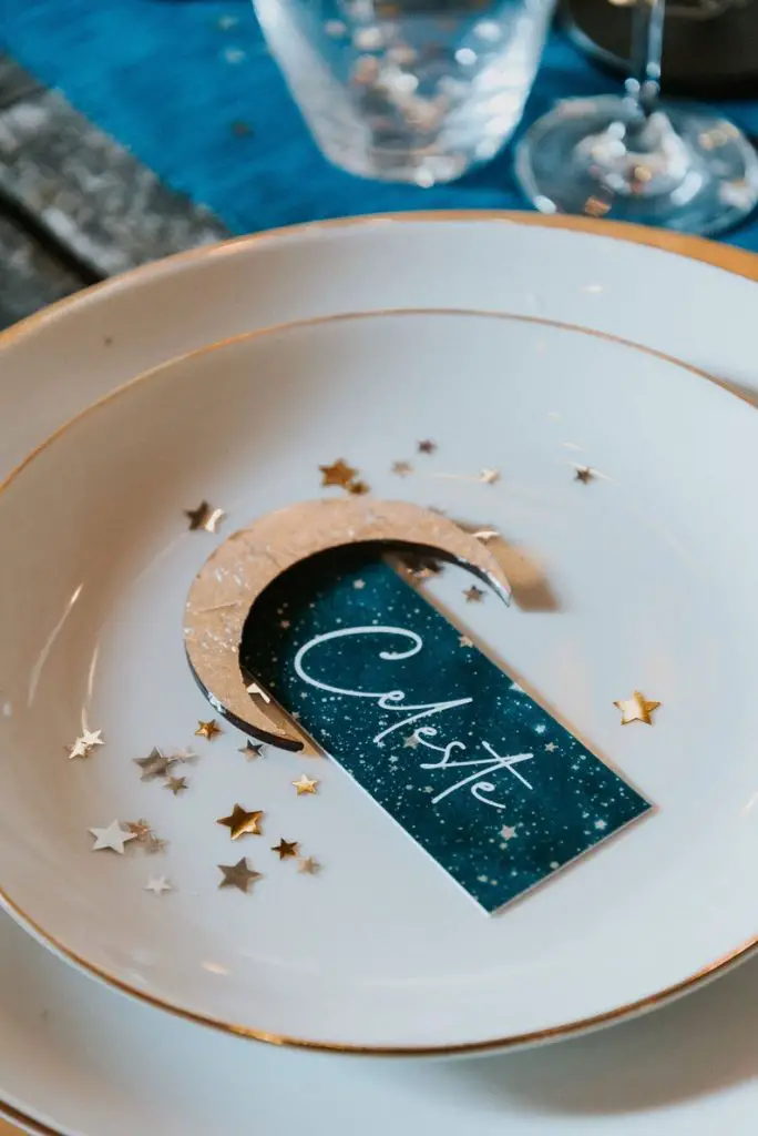Celestial wedding place card with gold leaf by SuzanneOddyDesign on Etsy - Sparkly celestial wedding theme ideas - The Wedding Club