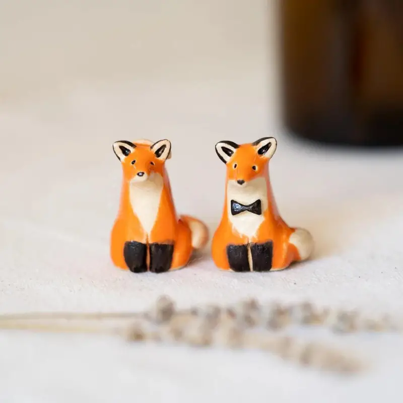 26. Handmade Ceramic Fox Couple Cake Toppers by VanilyaCeramics on Etsy - 27 Unique Engagement Gifts for the Couple - The Wedding Club