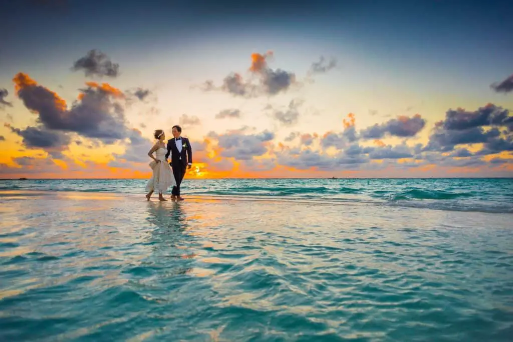 Photo by Asad Photo Maldives: https://www.pexels.com/photo/man-and-woman-walking-of-body-of-water-1024993/