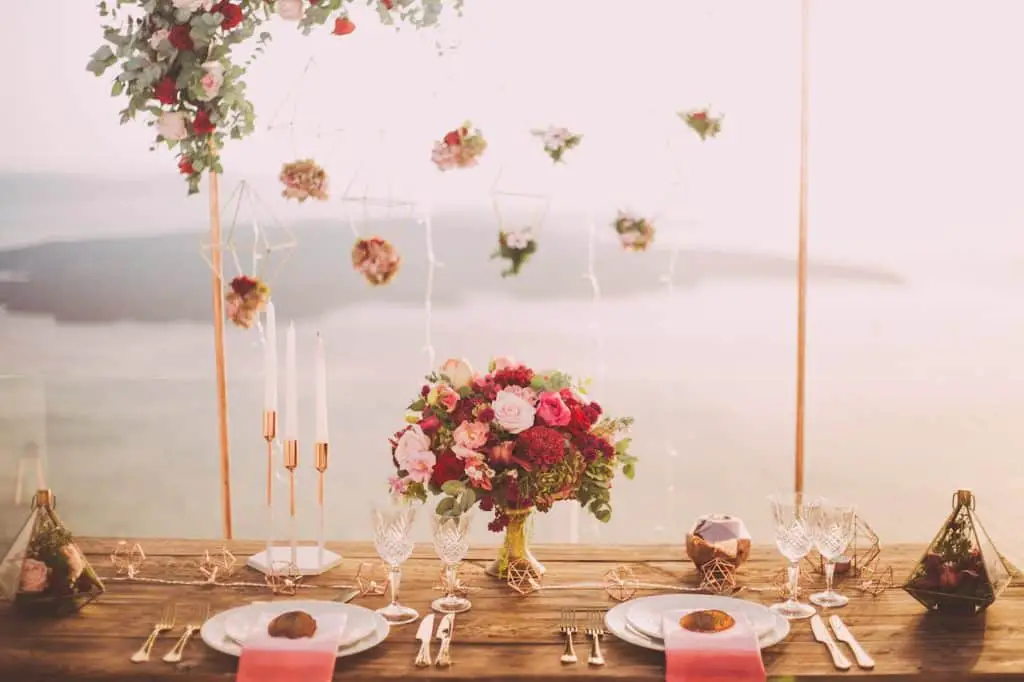 Photo by Edward Eyer: https://www.pexels.com/photo/pink-and-red-roses-centerpiece-near-silverwares-1045541/