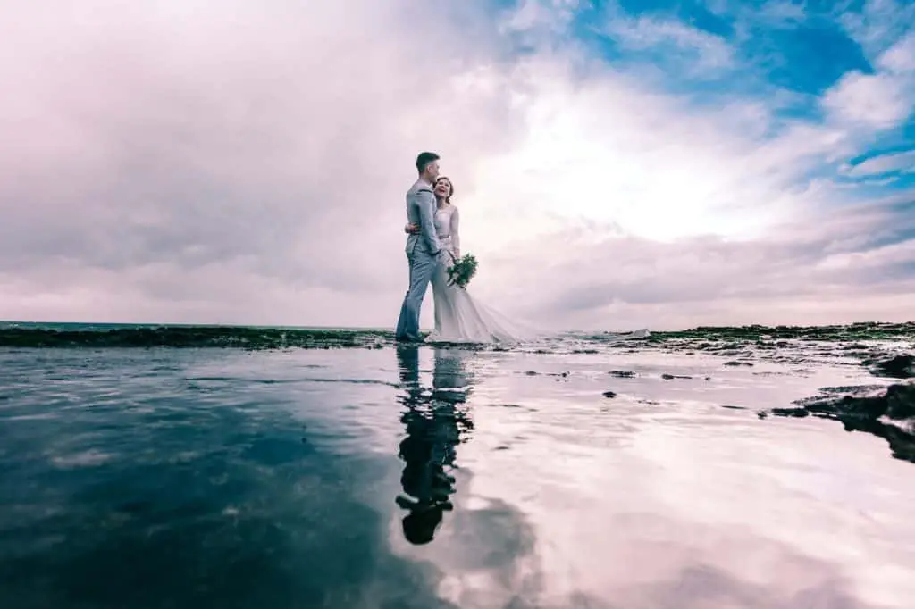 Photo by Nghia Trinh: https://www.pexels.com/photo/man-in-gray-dress-suit-jacket-embraces-woman-wearing-wedding-gown-931796/