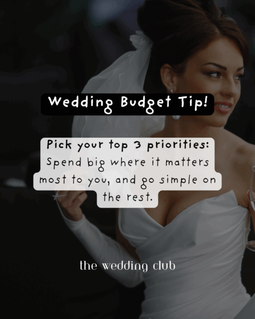 Smiling bride in modern white gown holding a drink with overlay text: "Wedding Budget Tip! Pick your top 3 priorities—Spend big where it matters most to you, and go simple on the rest. The Wedding Club.