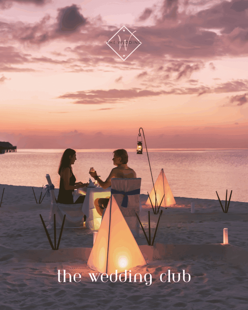 Candlelit beach dinner at sunset – romantic mini-moon experience for newlyweds on a budget-friendly honeymoon.