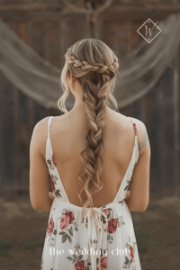 Boho braided crown hairstyle, floral maxi dress, leather sandals, rustic barn wedding background