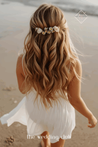 Tousled beach waves with small floral hair clips, flowy white sundress, barefoot sandals, tropical seaside wedding