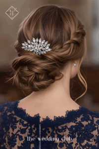 Braided chignon hairstyle, navy lace gown, jeweled hair comb, formal church wedding