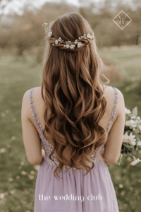 Long loose curls with small floral pins, flowy lavender gown, outdoor spring wedding ceremony